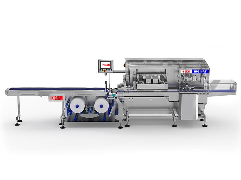 High-speed industrial packaging machine with conveyor belt, rollers, and a control panel, branded SACMI.